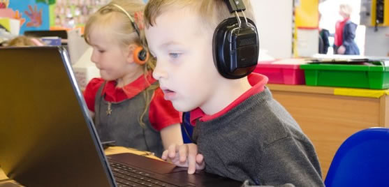 Photo of a boy taking a recorded voice quiz